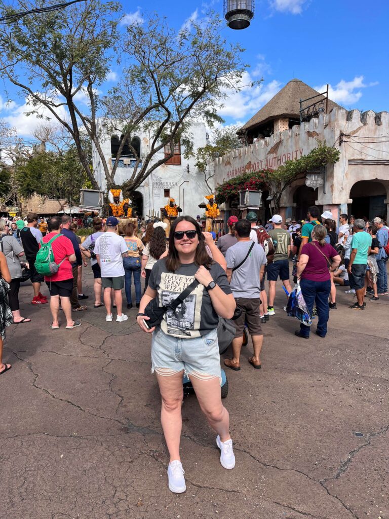 Rachael from Adventures by April Gold in an African inspired area of Disney's Animal Kingdom Park watching African Drummers perform