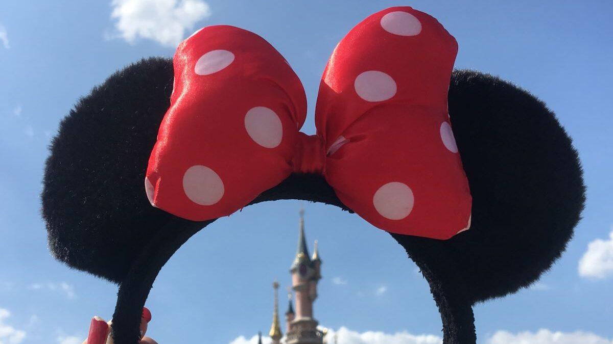 Is Disney World for Adults? Picture of Minnie Ears above Sleeping Beauty castle at Disneyland Paris